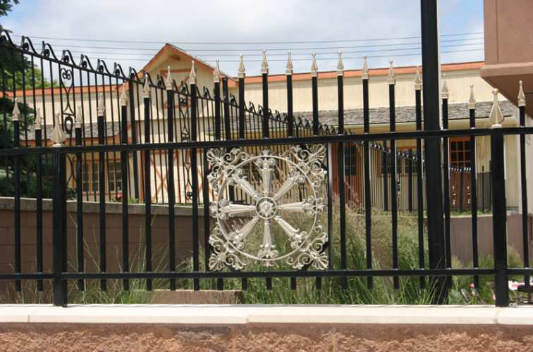 AmeriFence Corporation Wichita - Custom Iron Gate Fencing, 1230 Overscallop with quad flare & emblem