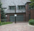 AmeriFence Corporation Wichita - Custom Gates, Double Drive Overscallop Gate With Puppy Accent